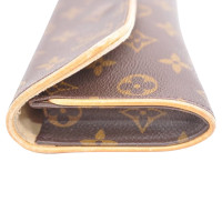 Louis Vuitton Pochette Leather in Brown