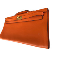 Hermès Kelly Clutch aus Leder in Orange
