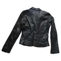 Pleats Please Leather jacket in black
