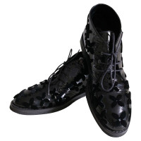 Alaïa Chaussures à lacets en Cuir verni en Noir