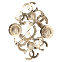 Chanel Gold colored brooch with pearls