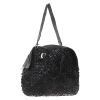 Salvatore Ferragamo Leather travel bag in black