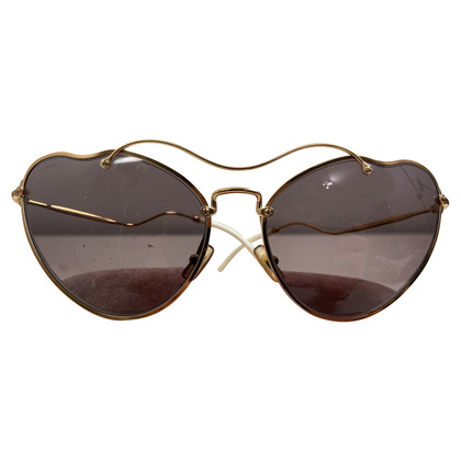 Miu Miu Sunglasses in Gold