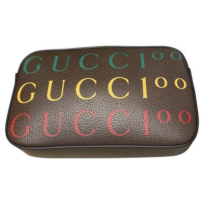 Gucci Clutch aus Leder in Braun