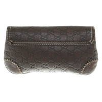 Gucci clutch con i modelli Guccissima