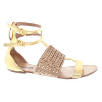Alaïa Sandals in gold