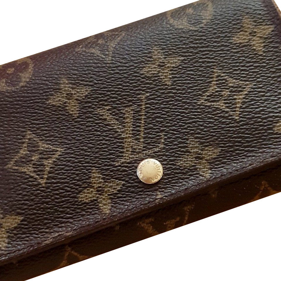 Louis Vuitton Täschchen/Portemonnaie aus Leder in Braun